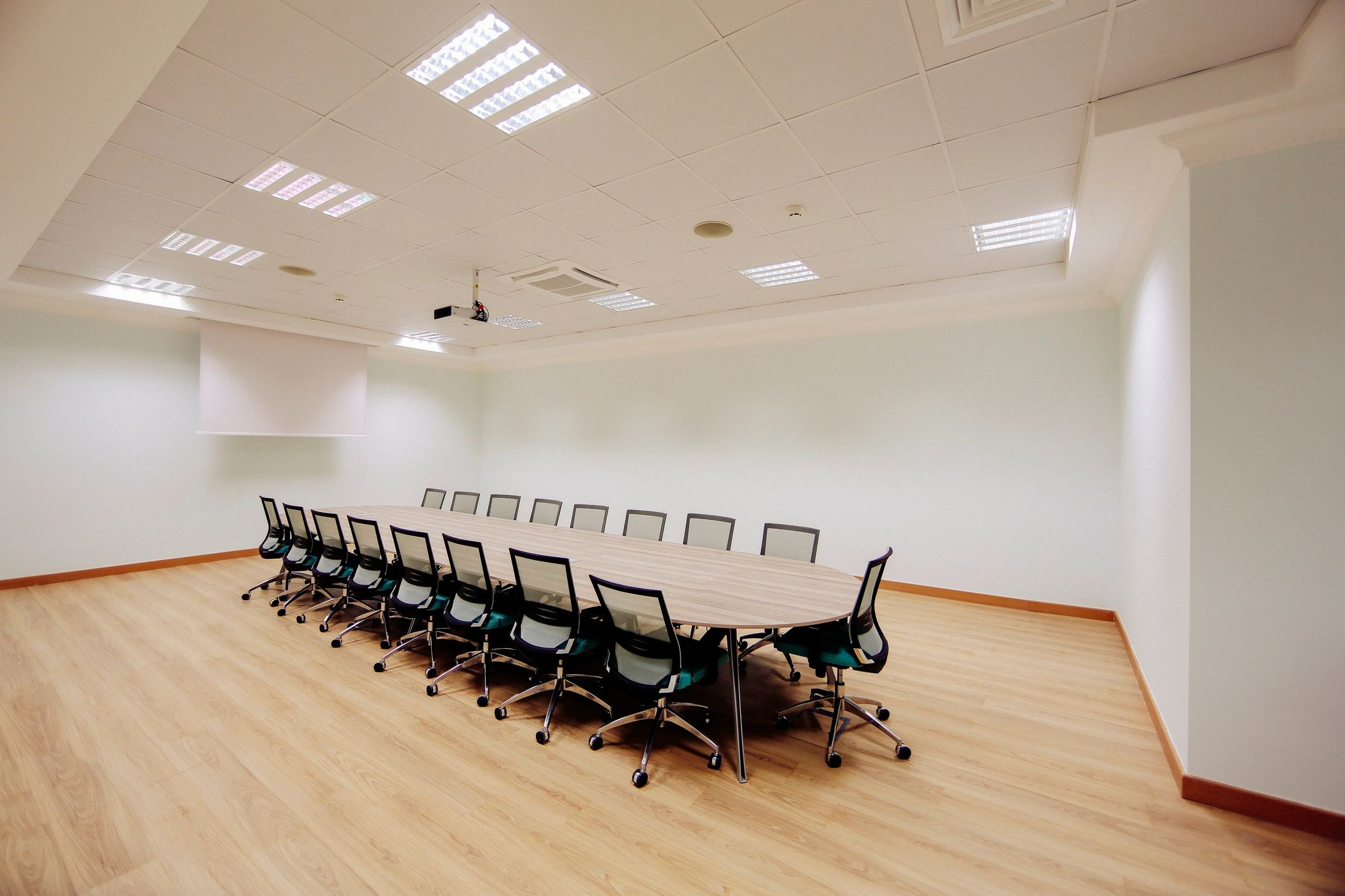 Empty meeting room with table and chairs