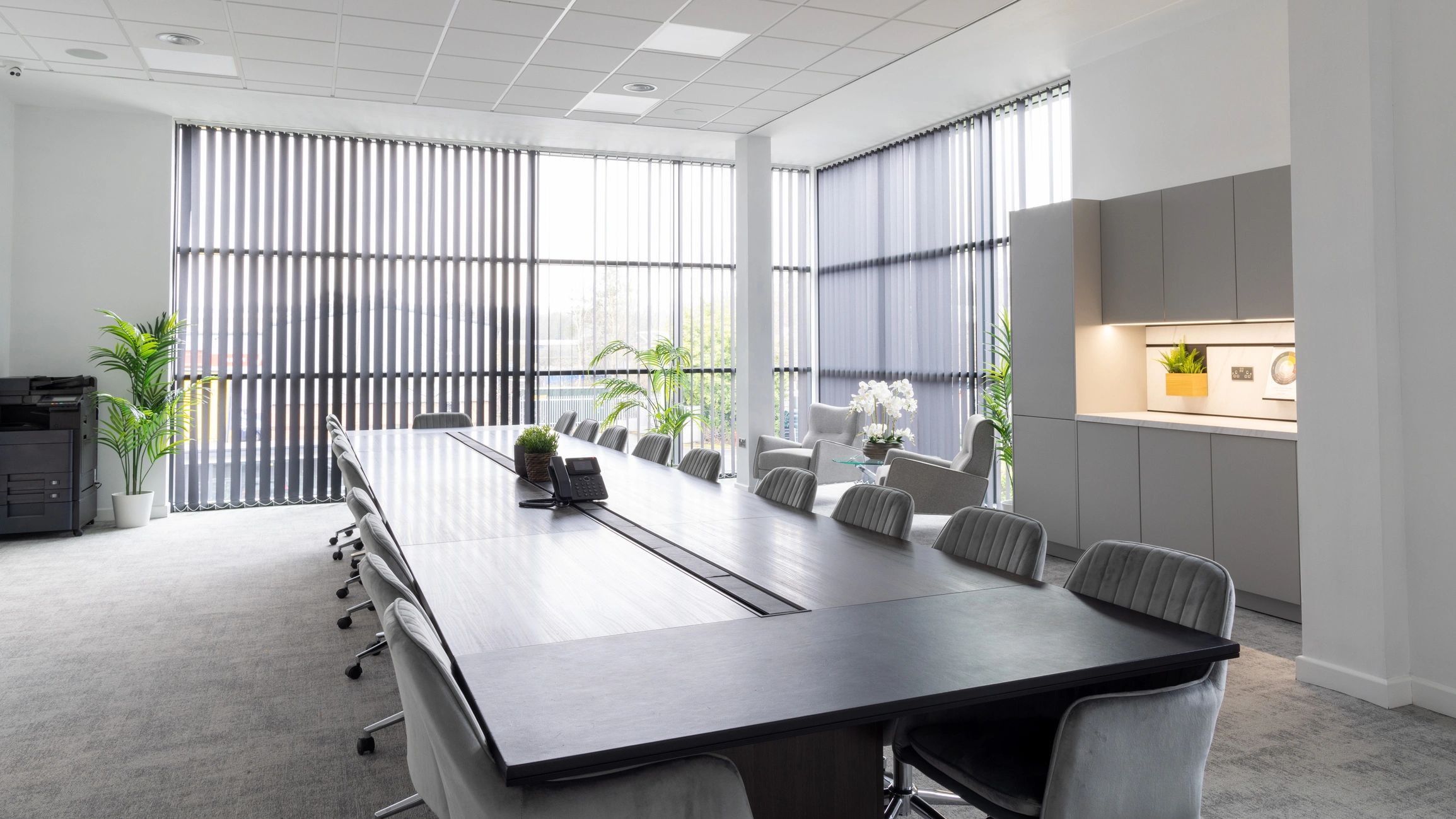 Contemporary conference room with large table and plants